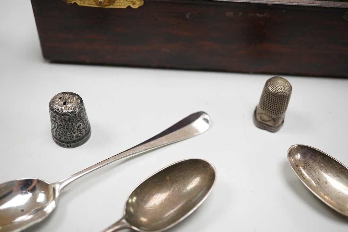 Three assorted 20th century silver napkin rings, a George V silver mustard pot and pepperette, a set of six late Victorian silver coffee spoons, London, 1883, and six other silver items.